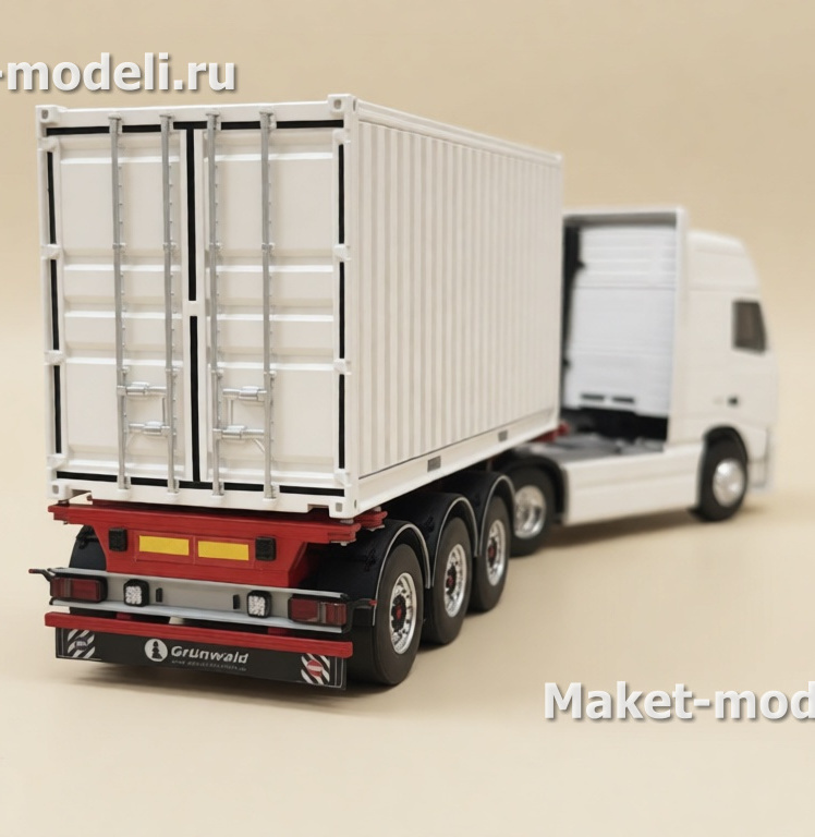 Масштабная модель магистрального седельного тягача Volvo FH 480, колесная формула 4×2, с трехосным полуприцепом-фургоном (контейнеровозом) Тягач компоновки с высокой спальной кабиной (high-roof sleeper cab). • Передняя светотехника: основные фары, блок дополнительных противотуманных/дальнобойных фар на переднем бампере. • Солнечный козырёк над ветровым стеклом, сигнальные огни на крыше кабины. • Фирменная решётка радиатора Volvo с логотипом и обозначением модели FH и мощности «480». • Смоделированные элементы ходовой части: односкатные шины на управляемой передней оси и ведущей задней. • Сцепка с трёхосным полуприцепом прямоугольного сечения (контейнер/фургон). Модель установлена на ровной поверхности, на фоне стеллажей с ячейками для хранения и коробок с другими моделями.