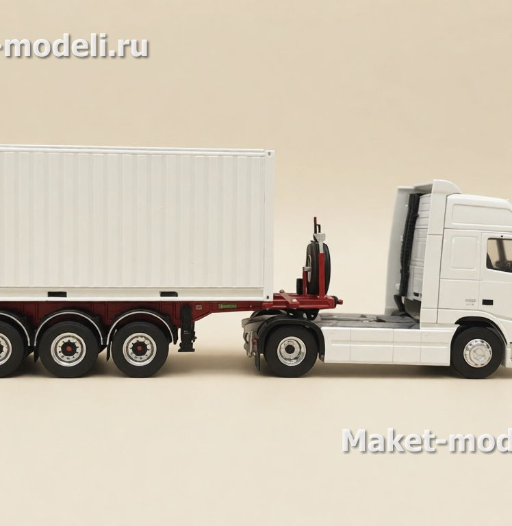 Масштабная модель магистрального седельного тягача Volvo FH 480, колесная формула 4×2, с трехосным полуприцепом-фургоном (контейнеровозом) Тягач компоновки с высокой спальной кабиной (high-roof sleeper cab). • Передняя светотехника: основные фары, блок дополнительных противотуманных/дальнобойных фар на переднем бампере. • Солнечный козырёк над ветровым стеклом, сигнальные огни на крыше кабины. • Фирменная решётка радиатора Volvo с логотипом и обозначением модели FH и мощности «480». • Смоделированные элементы ходовой части: односкатные шины на управляемой передней оси и ведущей задней. • Сцепка с трёхосным полуприцепом прямоугольного сечения (контейнер/фургон). Модель установлена на ровной поверхности, на фоне стеллажей с ячейками для хранения и коробок с другими моделями.